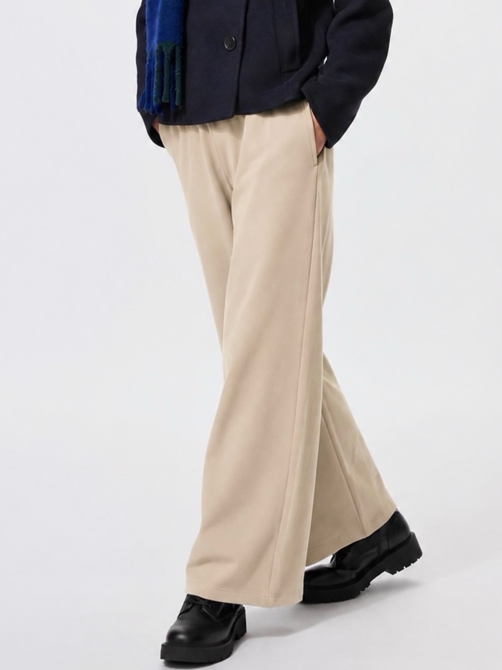 UNIQLO cream wide leg pants in size M. Nylon, cotton, acrylic & spandex blend.